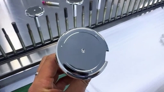 Silver-colored circular plastic part with coating