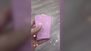 The perfume bottle is vacuum-coated with a pink or blue film layer.